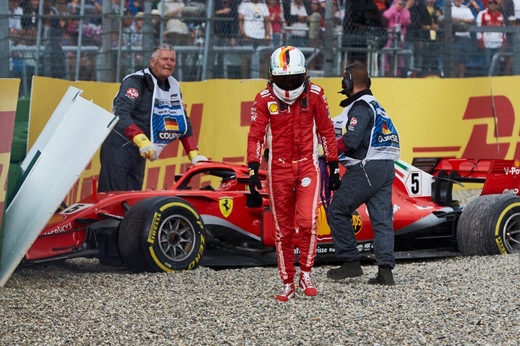 Sebastian Vettel walks away from his Ferrari after crashing at the 2018 German Grand Prix.