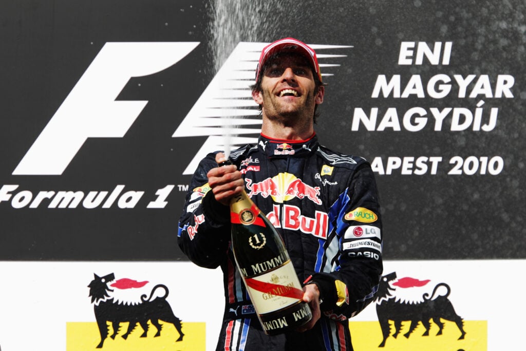 Red Bull's Mark Webber celebrates on the podium after winning the 2010 Hungarian Grand Prix.