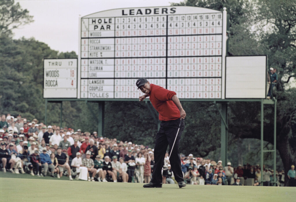 Tiger Woods holes the winning put to lift the 1997 Masters