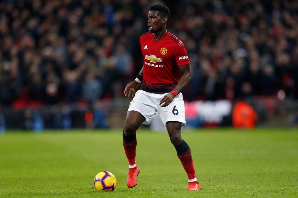Paul Pogba playing in a Premier League match between Manchester United and Tottenham Hotspur.
