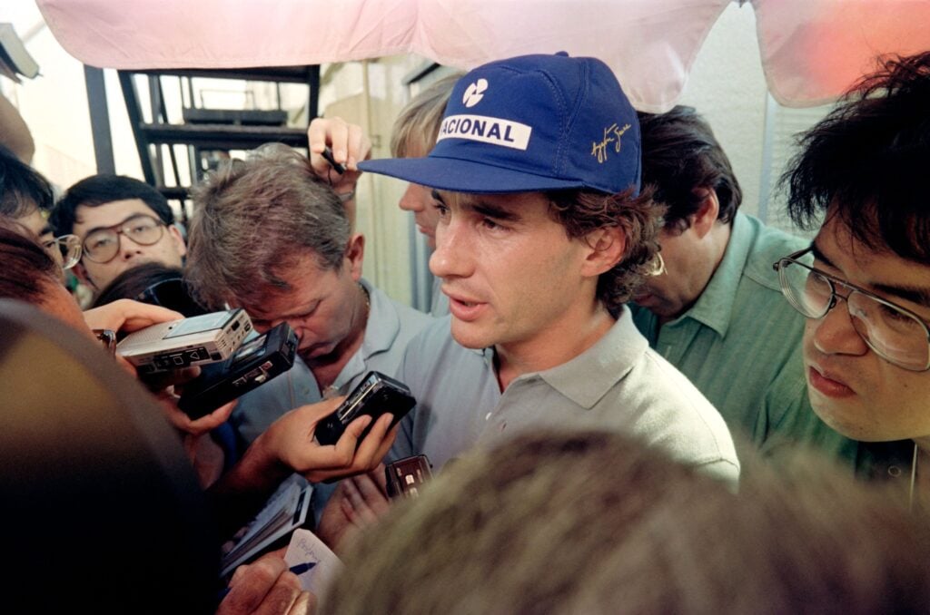 Ayrton Senna answering the questions of reporters at the 1990 Japanese Grand Prix.