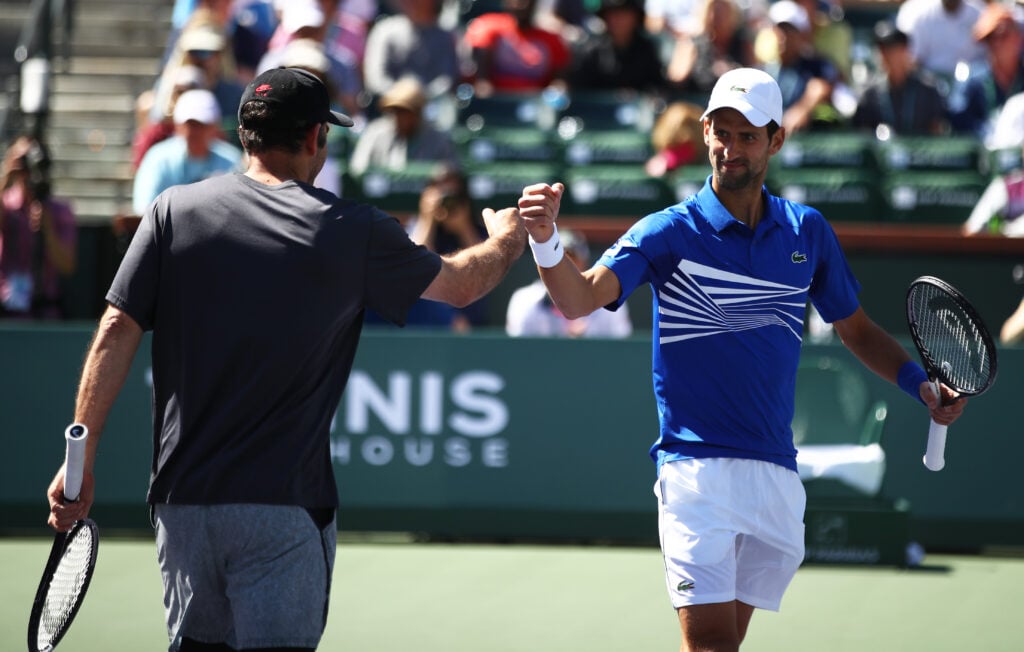 Novak Djokovic and Pete Sampras during their exhibition doubles match