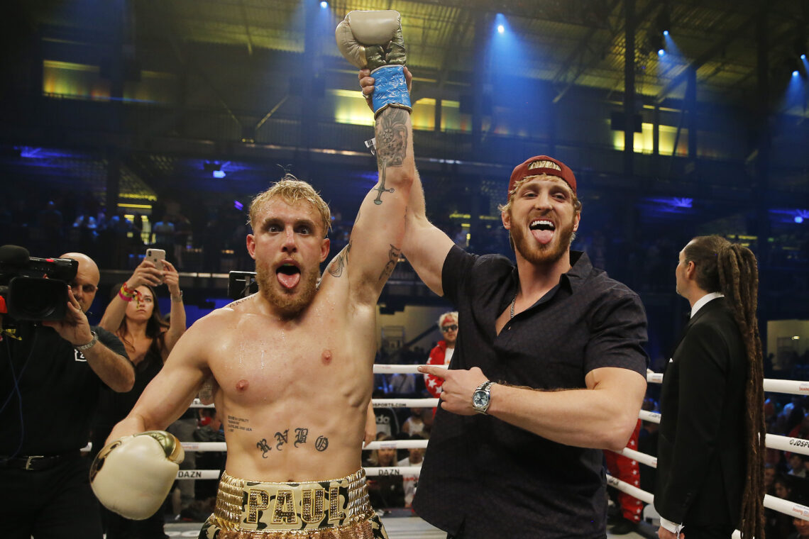 Logan Paul lifting Jake Paul's arm after his bout with AnEsonGib