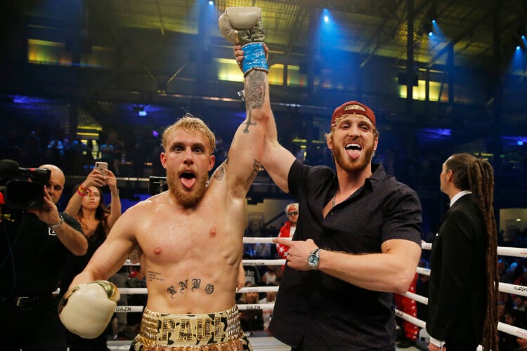 Logan Paul lifting Jake Paul's arm after his bout with AnEsonGib