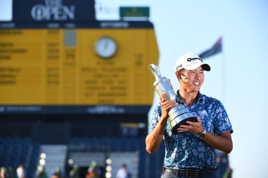Collin Morikawa poses with the Claret Jug trophy after winning the 2021 Open Championship