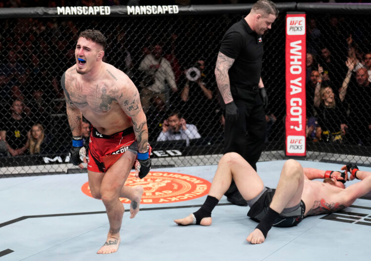 Tom Aspinall of England celebrates his submission victory over Alexander Volkov