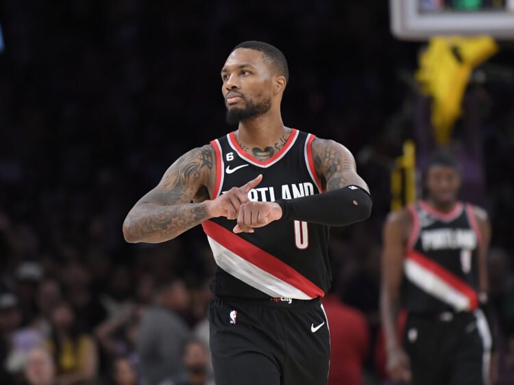 Damian Lillard #0 of the Portland Trail Blazers celebrates as he points to his wrist