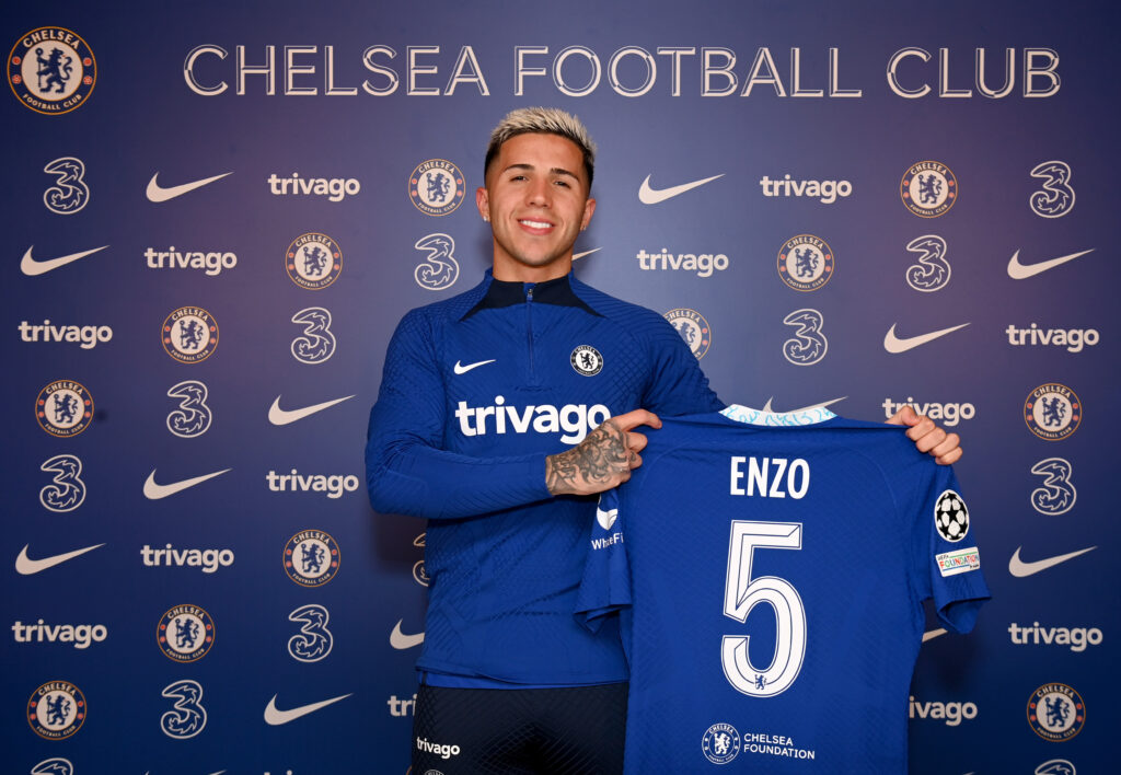 Chelsea unveil new signing Enzo Fernandez, who holds his number 5 shirt to the camera.