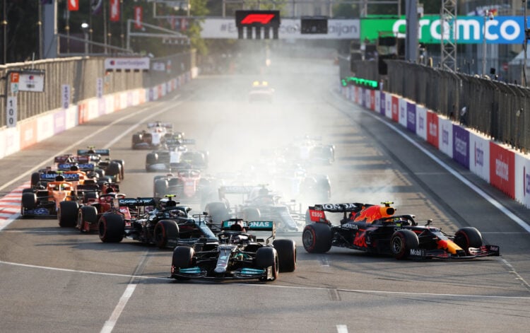 Lewis Hamilton's Mercedes drives straight at Turn 1 at the 2021 Azerbaijan Grand Prix as the remaining grid drives past