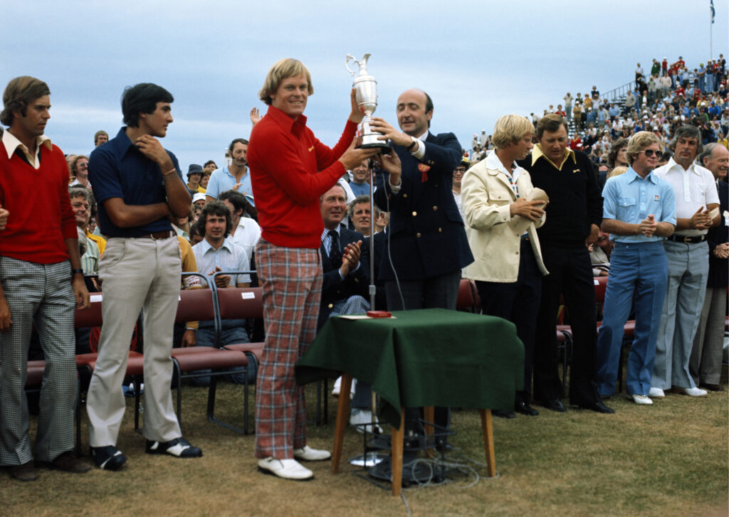 Johnny Miller lifts the Claret Jug after winning The Open Championship in 1976