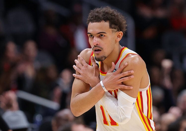 Trae Young #11 of the Atlanta Hawks reacts after hitting a three-point basket