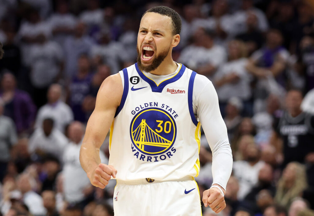 Stephen Curry celebrates victory against the Sacramento Kings in Game Seven of the Western Conference Playoffs.