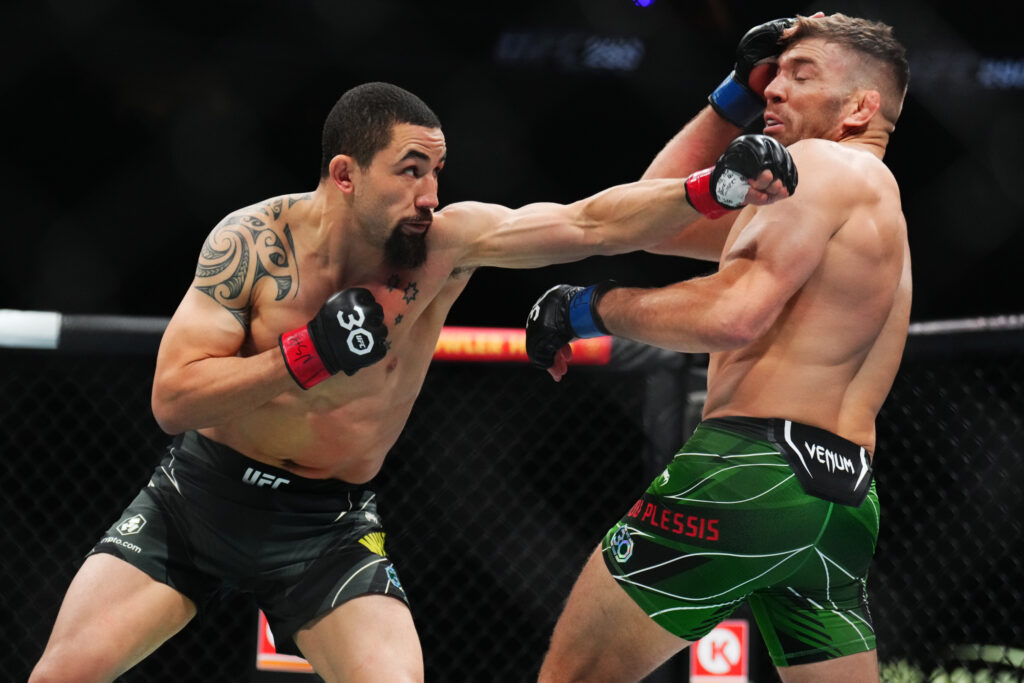 Robert Whittaker punches Dricus Du Plessis