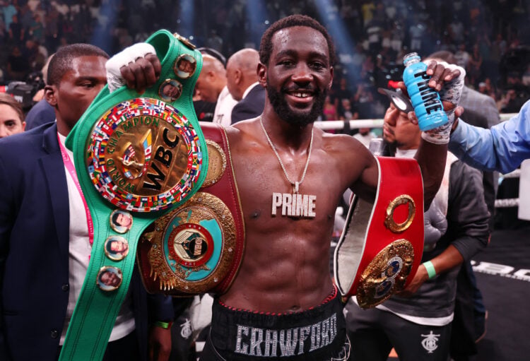 Terence Crawford smiles and celebrates after beating Errol Spence Jr