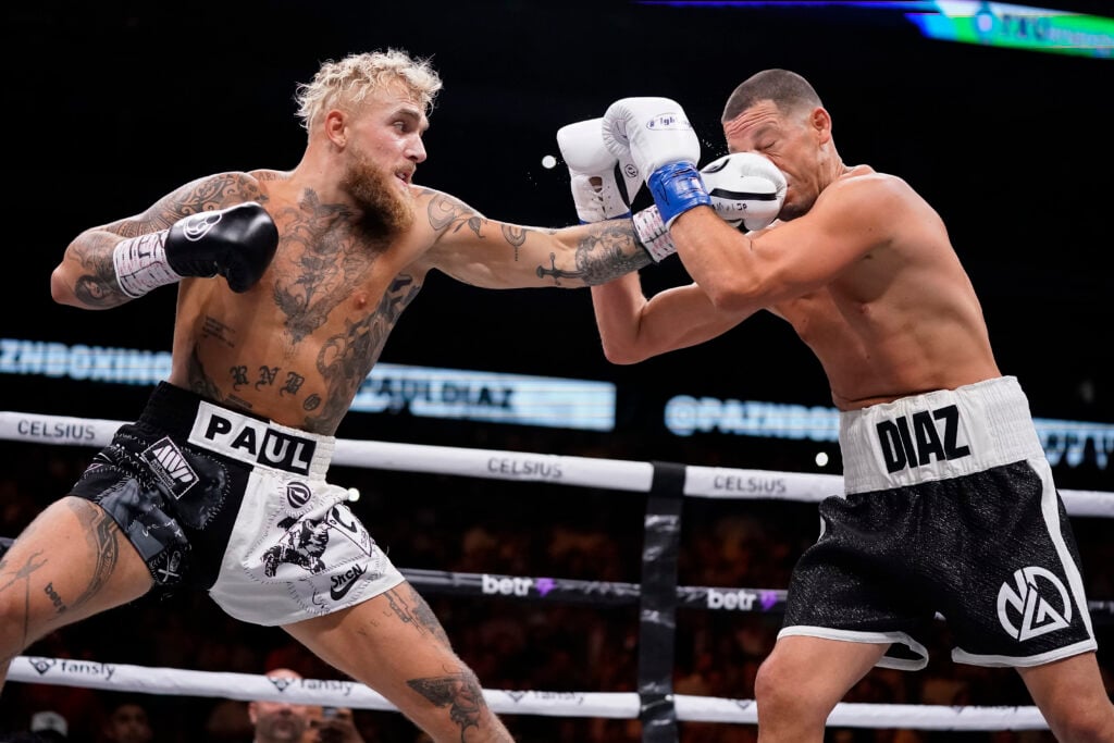 Jake Paul throws a left at Nate Diaz during the first round of their fight