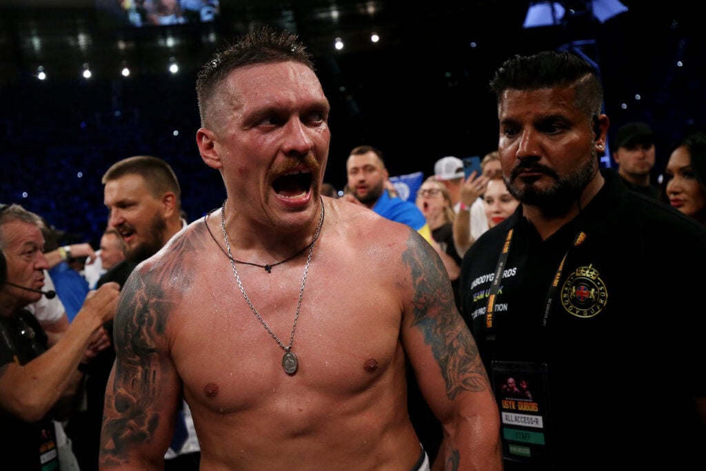 Oleksandr Usyk celebrates victory after defeating Daniel Dubois