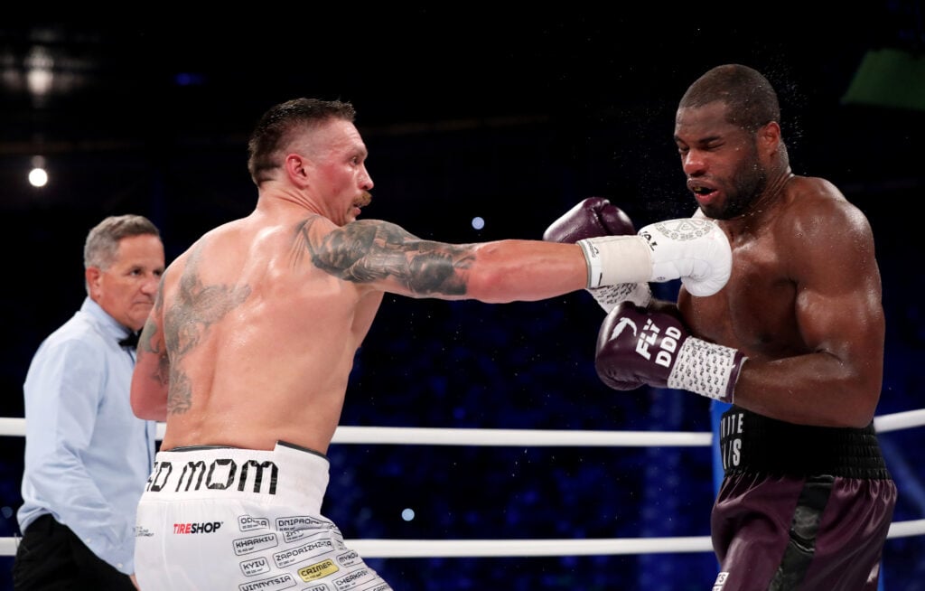 Oleksandr Usyk punches Daniel Dubois during the Heavyweight fight