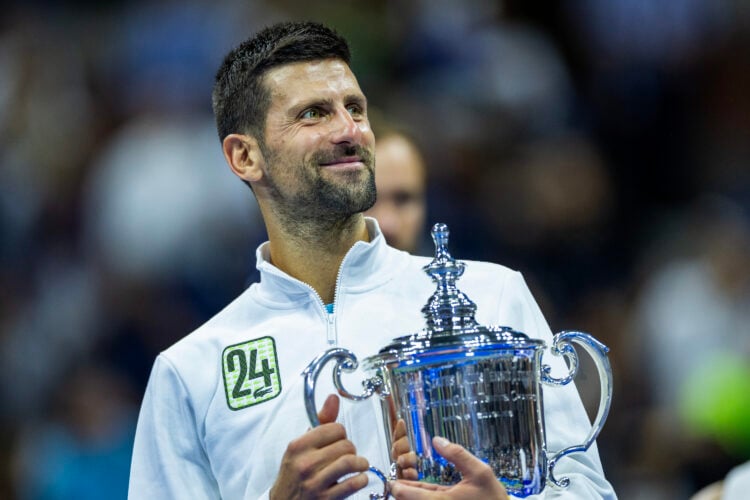 Novak Djokovic holds the US Open trophy after beating Daniil Medvedev in the 2023 final.