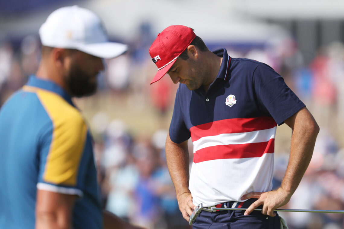 Scottie Scheffler of Team United States with hands on hips.
