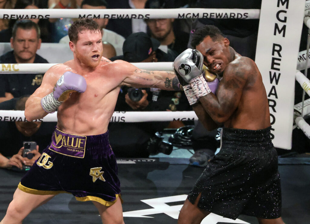 Canelo Alvarez throws a left at Jermell Charlo in the fifth round