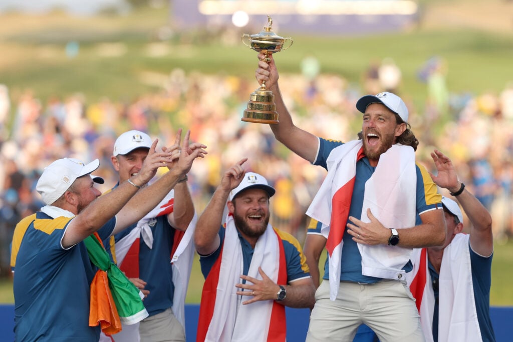 Tommy Fleetwood of Team Europe lifts the Ryder Cup trophy