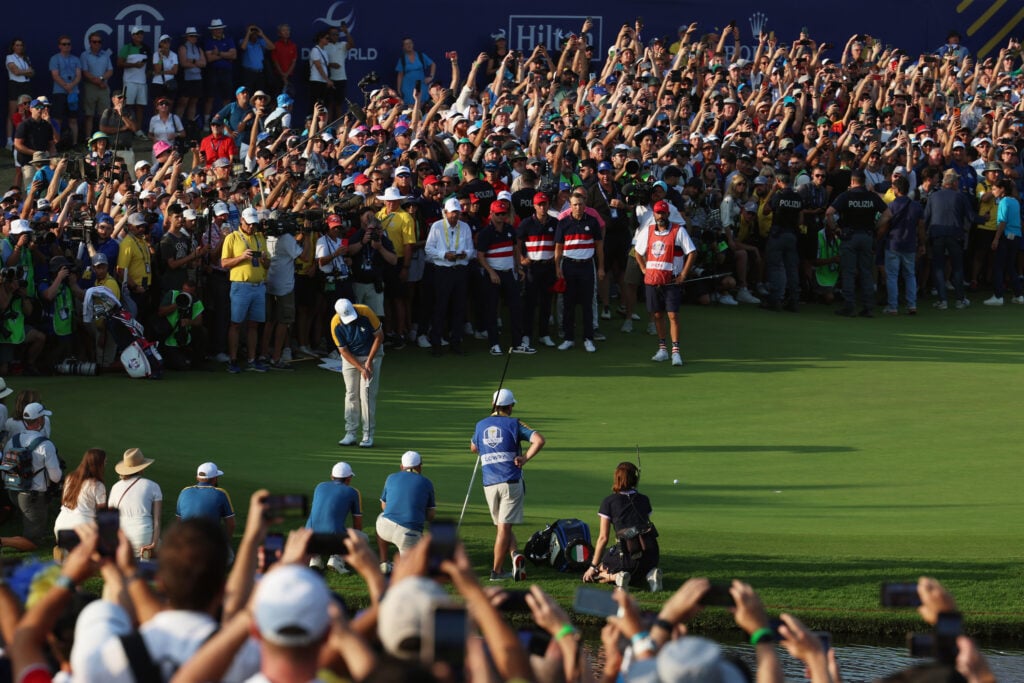 Fans watch Shane Lowry putting on the 18th green at the 2023 Ryder Cup.