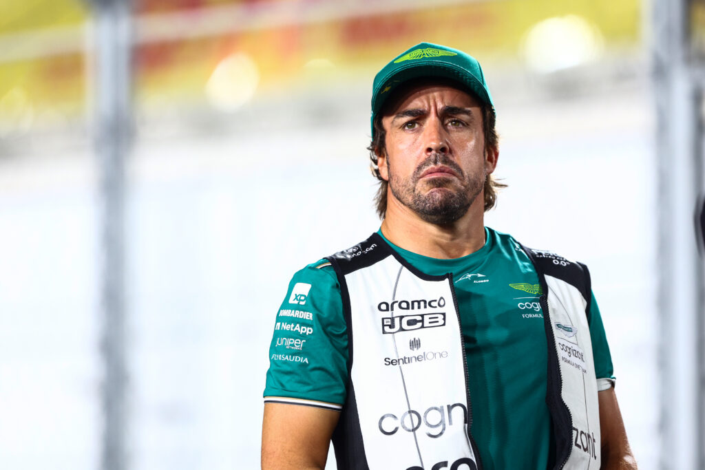 Fernando Alonso of Spain and Aston Martin F1 Team looks on from the drivers parade