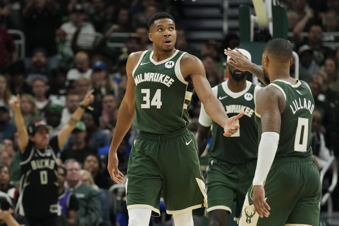 Giannis Antetokounmpo #34 and Damian Lillard #0 of the Milwaukee Bucks