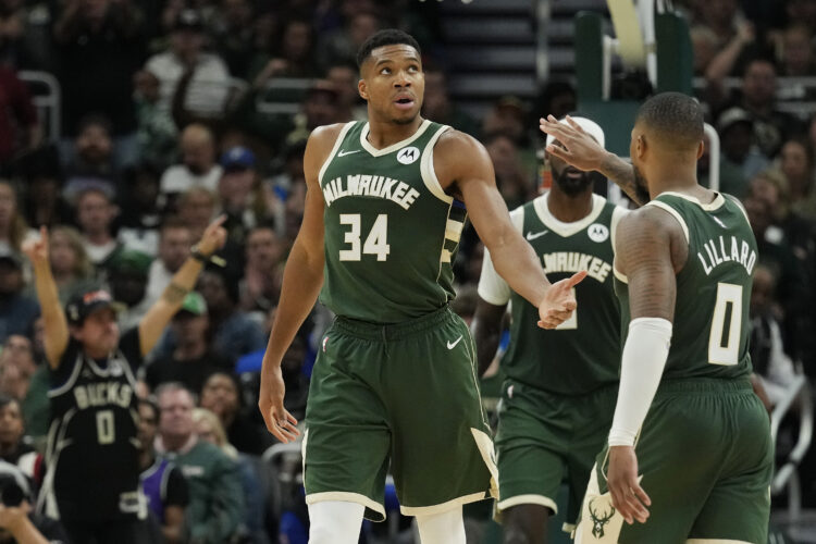 Giannis Antetokounmpo #34 and Damian Lillard #0 of the Milwaukee Bucks