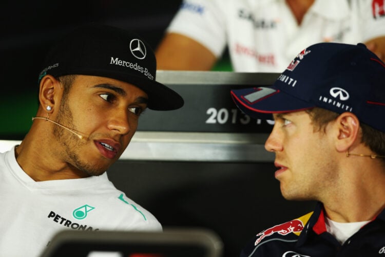 Mercedes driver Lewis Hamilton and Red Bull driver Sebastian Vettel speaking at a press conference at the 2013 Formula 1 Abu Dhabi Grand Prix