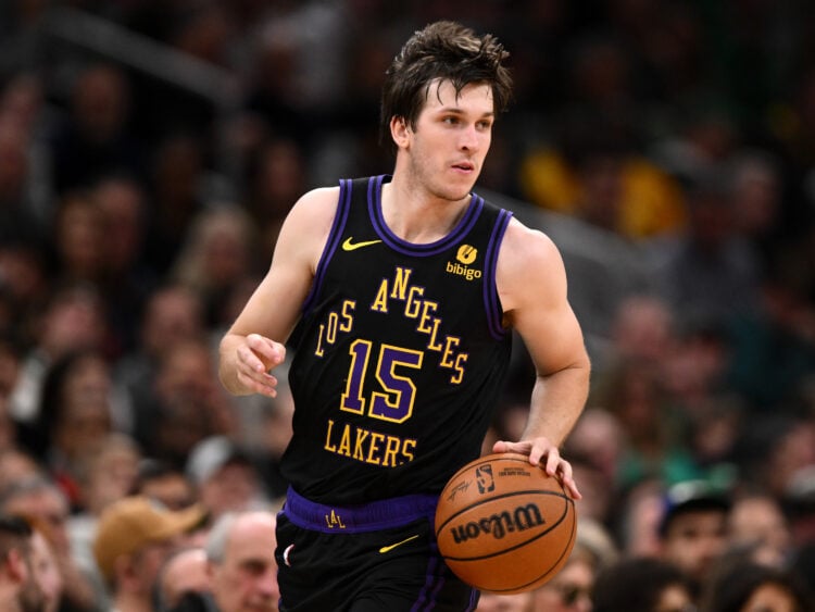 Austin Reaves #15 of the Los Angeles Lakers dribbles the ball
