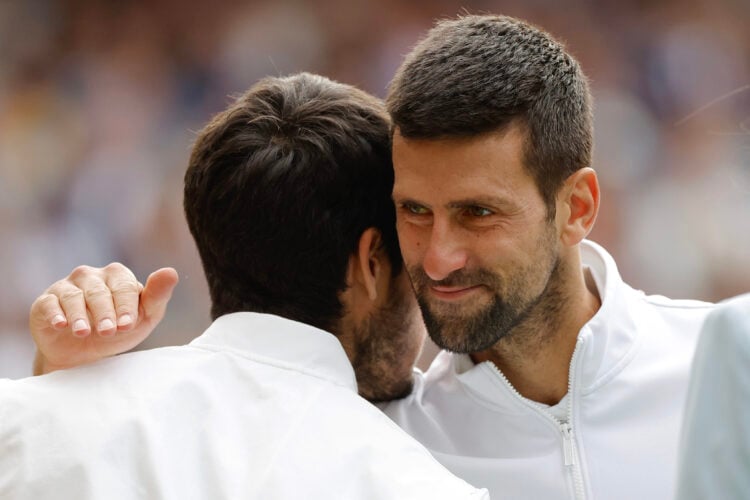 Novak Djokovic embracing Carlos Alcaraz at the Wimbledon 2023 final