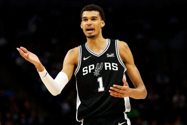 Victor Wembanyama #1 of the San Antonio Spurs reacts