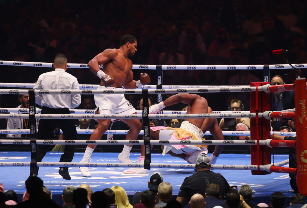 Anthony Joshua stands over Francis Ngannou after landing knockout blow