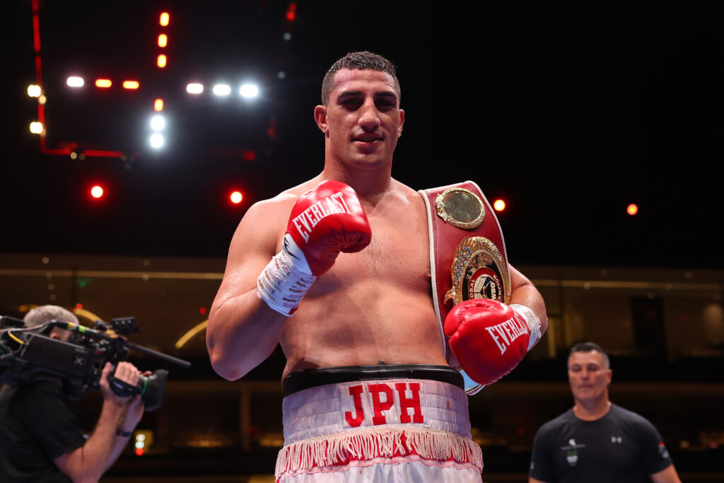 Justis Huni celebrates defeating Kevin Lerena