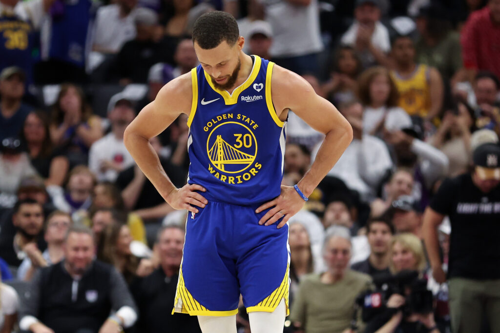Stephen Curry #30 of the Golden State Warriors stands with hands on hips