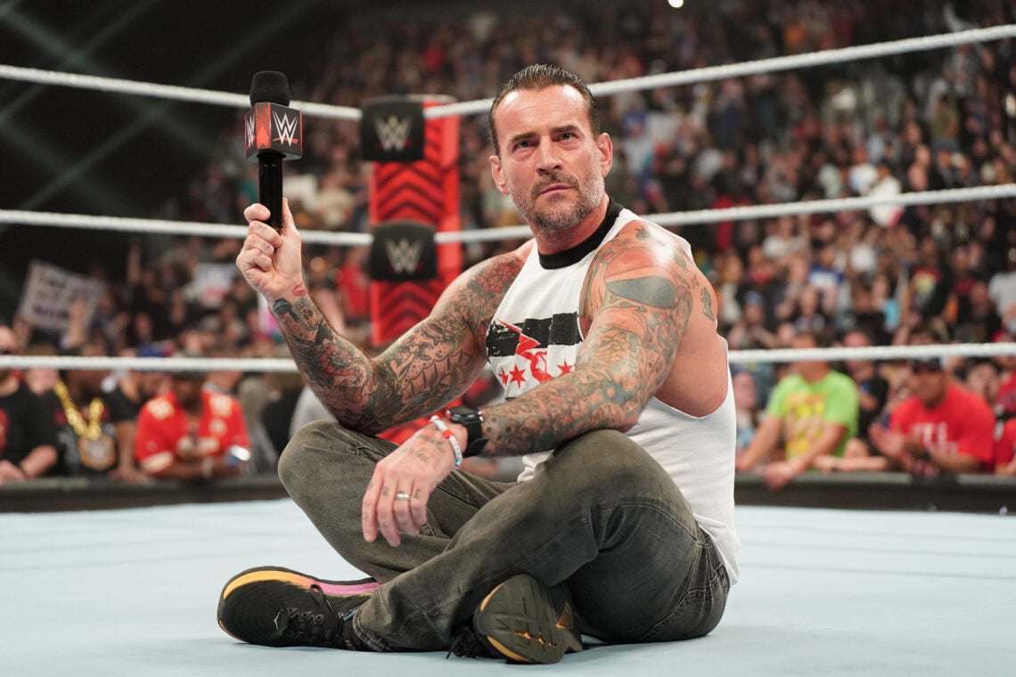 CM Punk sat on the mat during WWE Monday Night RAW