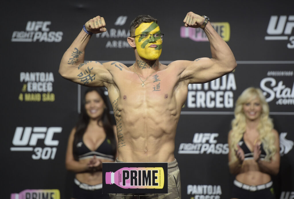 Caio Borralho of Brazil poses on the scale during the UFC 301 ceremonial weigh-in