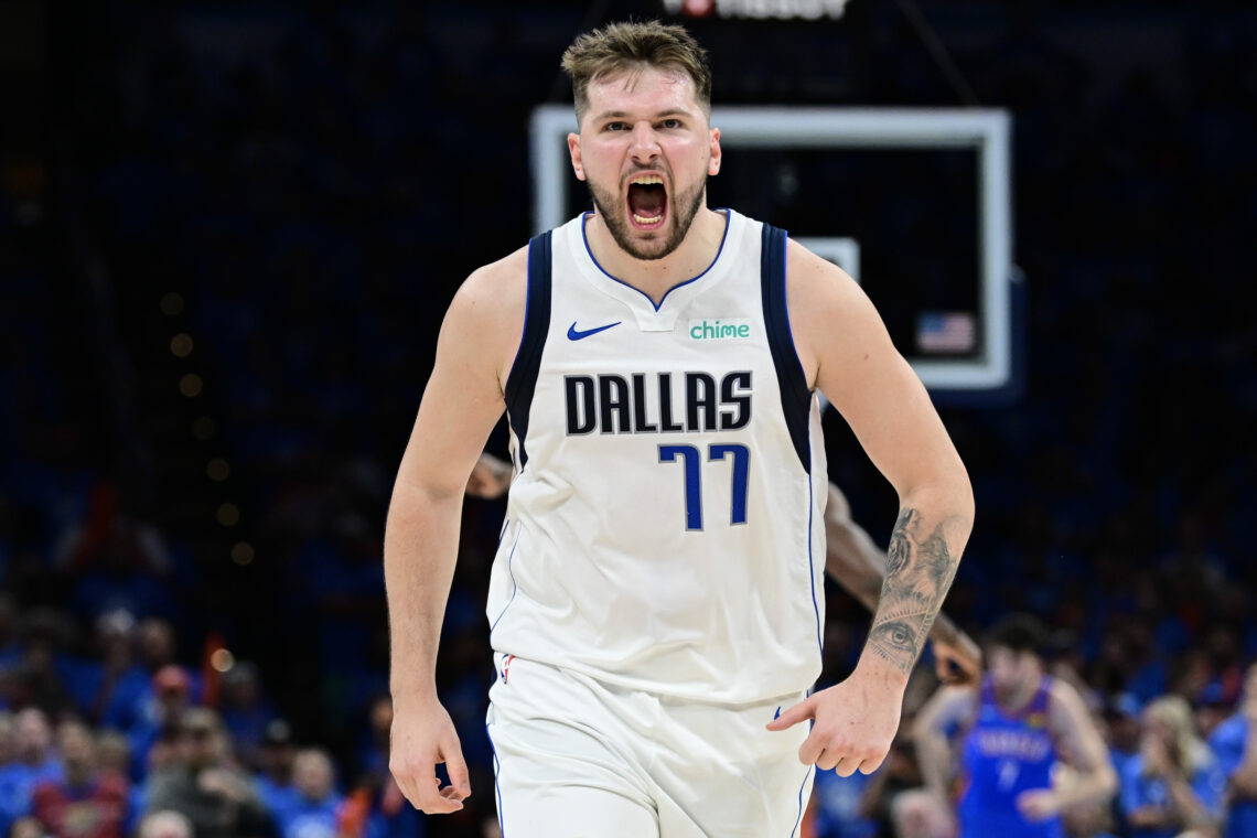 Luka Doncic #77 of the Dallas Mavericks screams in celebration.
