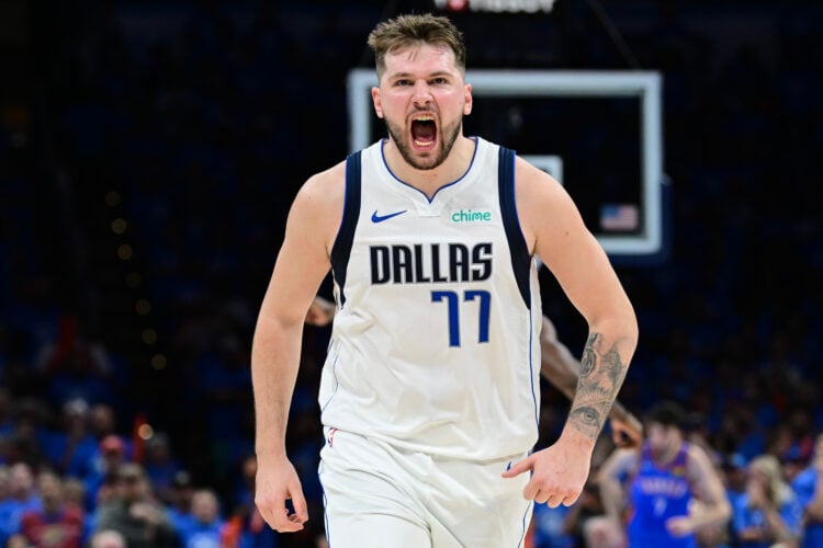 Luka Doncic #77 of the Dallas Mavericks screams in celebration.