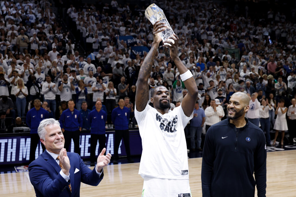 Naz Reid celebrating his Sixth Man of the Year award at Minnesota.