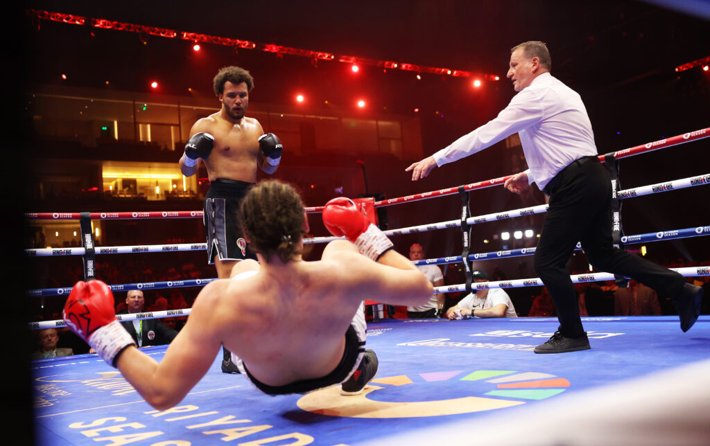 Ilja Mezencev is knocked down by Moses Itauma during the WBO Inter-Continental Heavyweight title fight