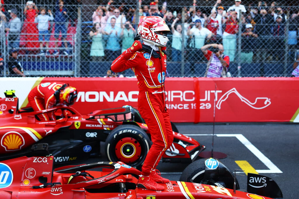Charles Leclerc celebrates atop his Ferrari after winning the 2024 Monaco Grand Prix.