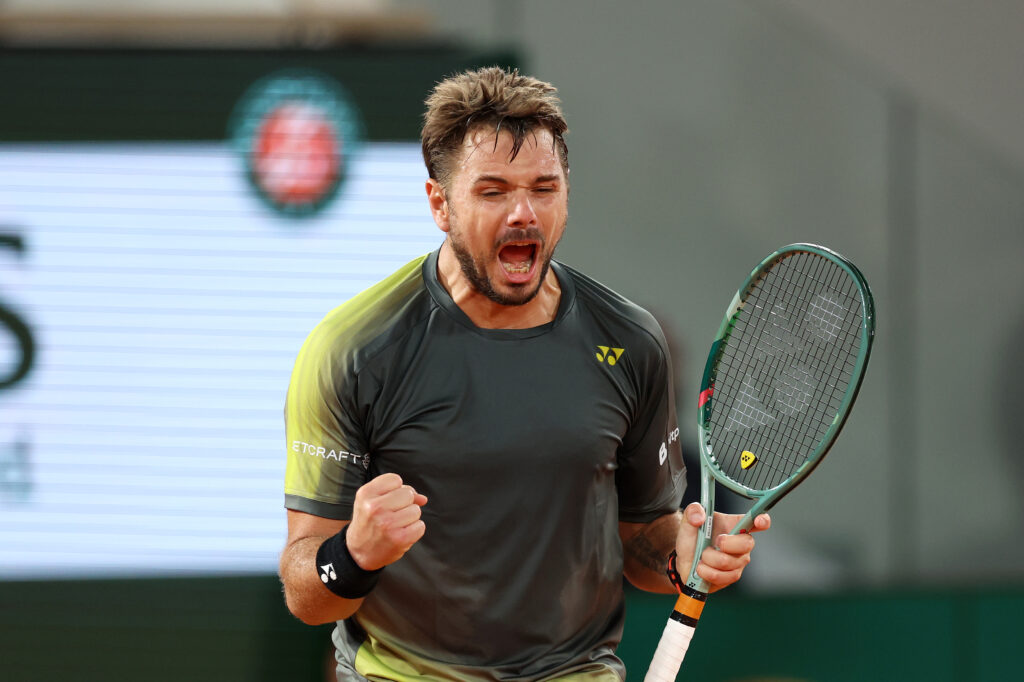 Stan Wawrinka of Switzerland celebrates winning match point against Andy Murray of Great Britain during the Men's Singles