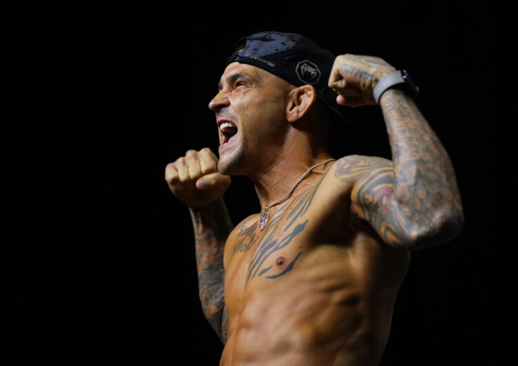 Dustin Poirier poses on the scale during his ceremonial weigh in ahead of UFC 302