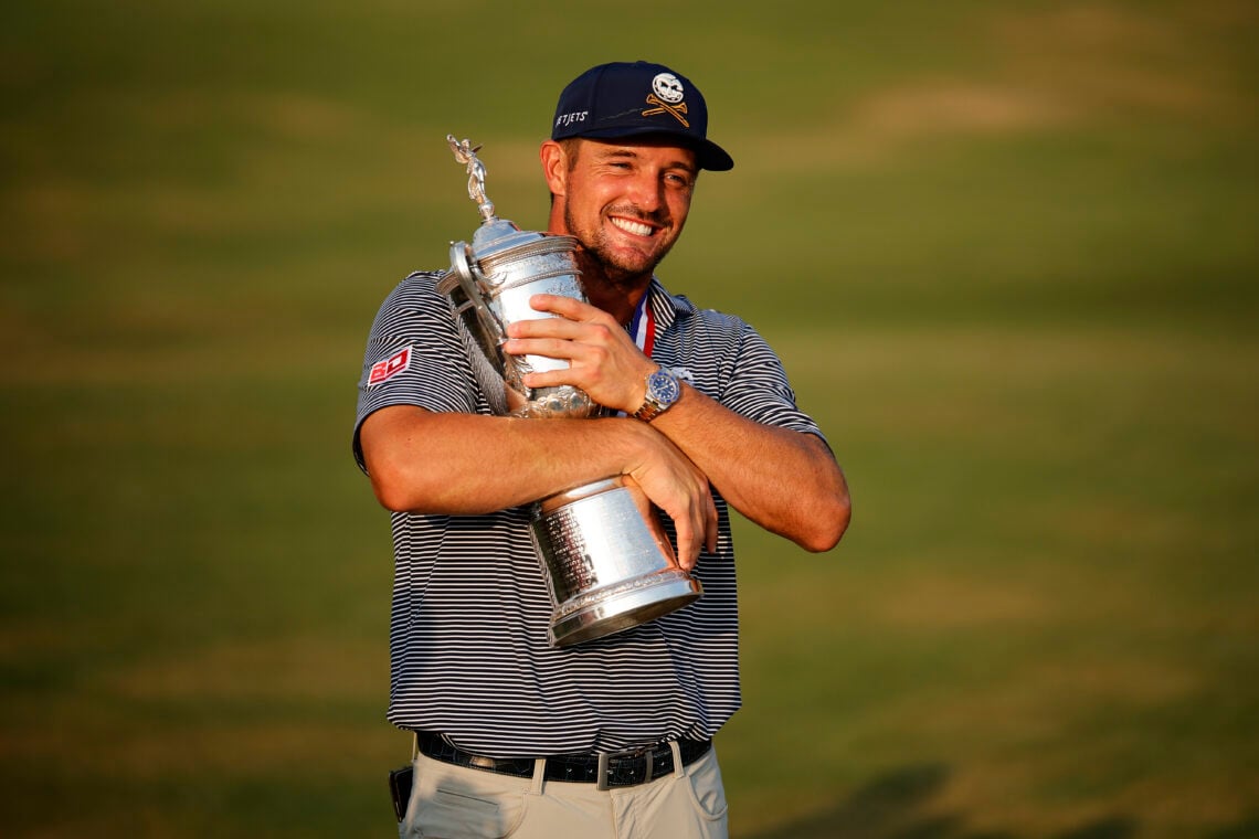 Bryson DeChambeau hugs trophy after winning 2024 U.S. Open