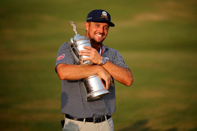 Bryson DeChambeau hugs trophy after winning 2024 U.S. Open