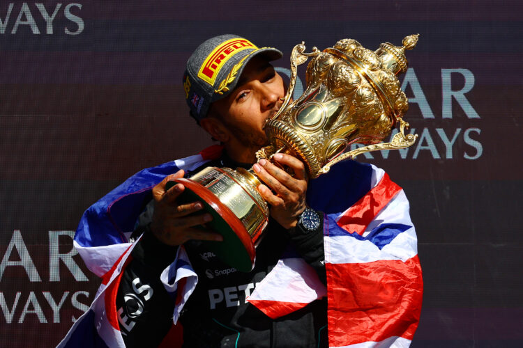 Race winner Lewis Hamilton of Great Britain and Mercedes celebrates on the podium during the F1 Grand Prix of Great Britain at Silverstone
