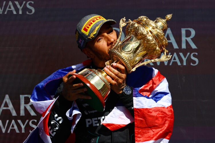 Race winner Lewis Hamilton of Great Britain and Mercedes celebrates on the podium during the F1 Grand Prix of Great Britain at Silverstone