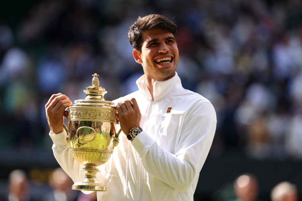 Carlos Alcaraz of Spain smiles with the Gentlemen's Singles Trophy